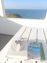 Books and crystals by the window with sea view